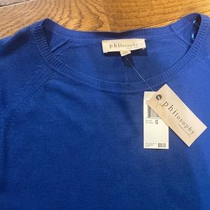 Philosophy blue sweater.